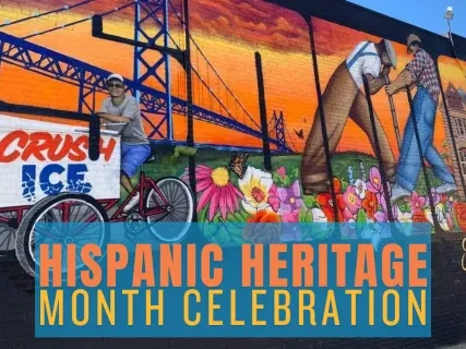 Colorful mural with vibrant scenes of Hispanic heritage, featuring workers and flowers under a bright orange sky.
