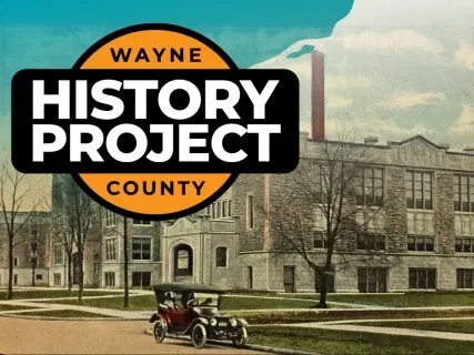 Historic building with an old car in front, overlaid by "Wayne County History Project" logo.
