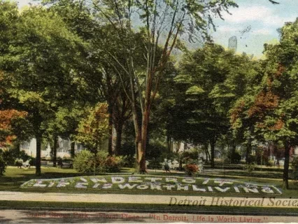 Postcard - Grand Circus Park, - Floral Piece: "In Detroit, Life is Worth Living."
