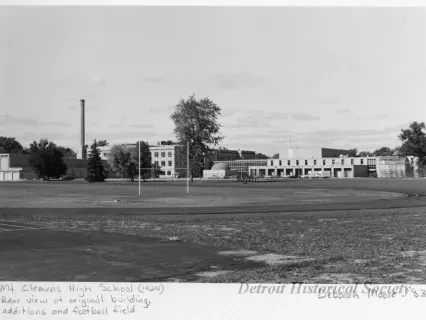Print, Photographic - Mt. Clemens High School (1924), Rear view of original building, additions and football field