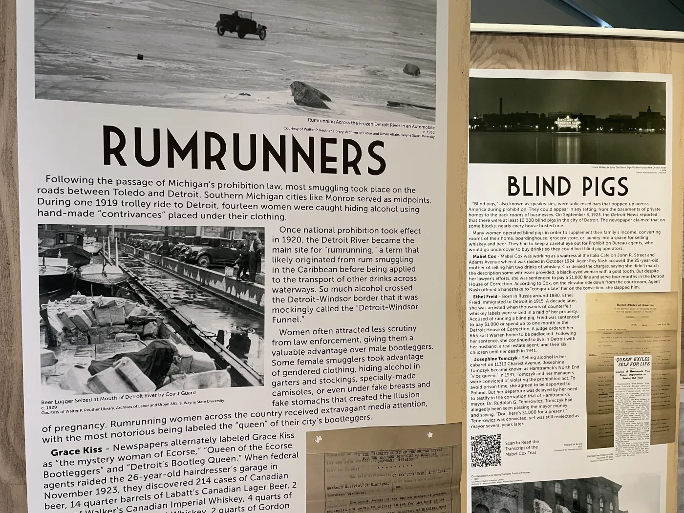 Historical exhibit featuring panels titled "Rumrunners" and "Blind Pigs," with black-and-white photos and descriptive text.